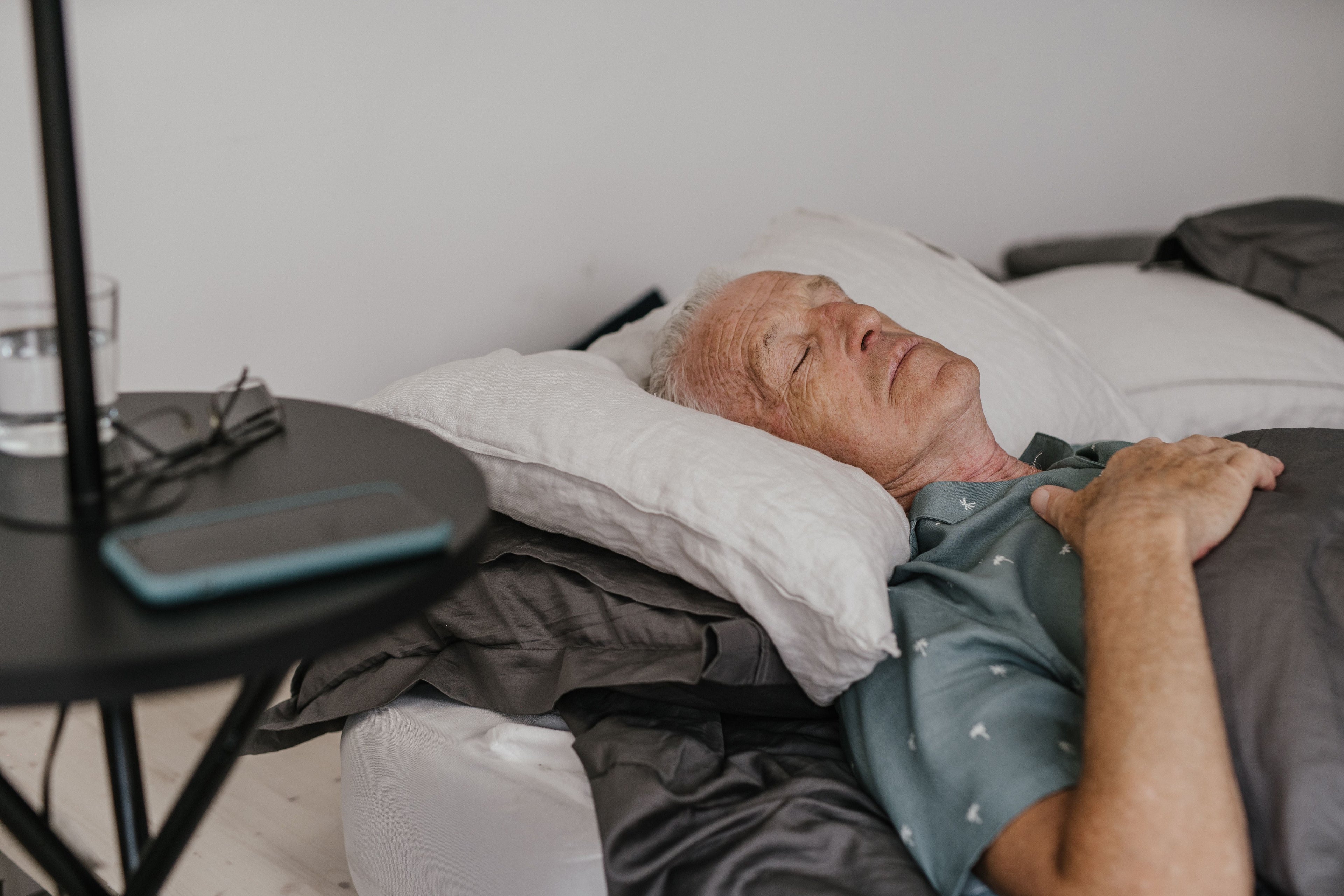 Senior couple sleeping peacefully in a calm bedroom